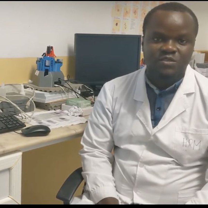 Image of technician in Tanzania with an using OpenFlexure Microscope