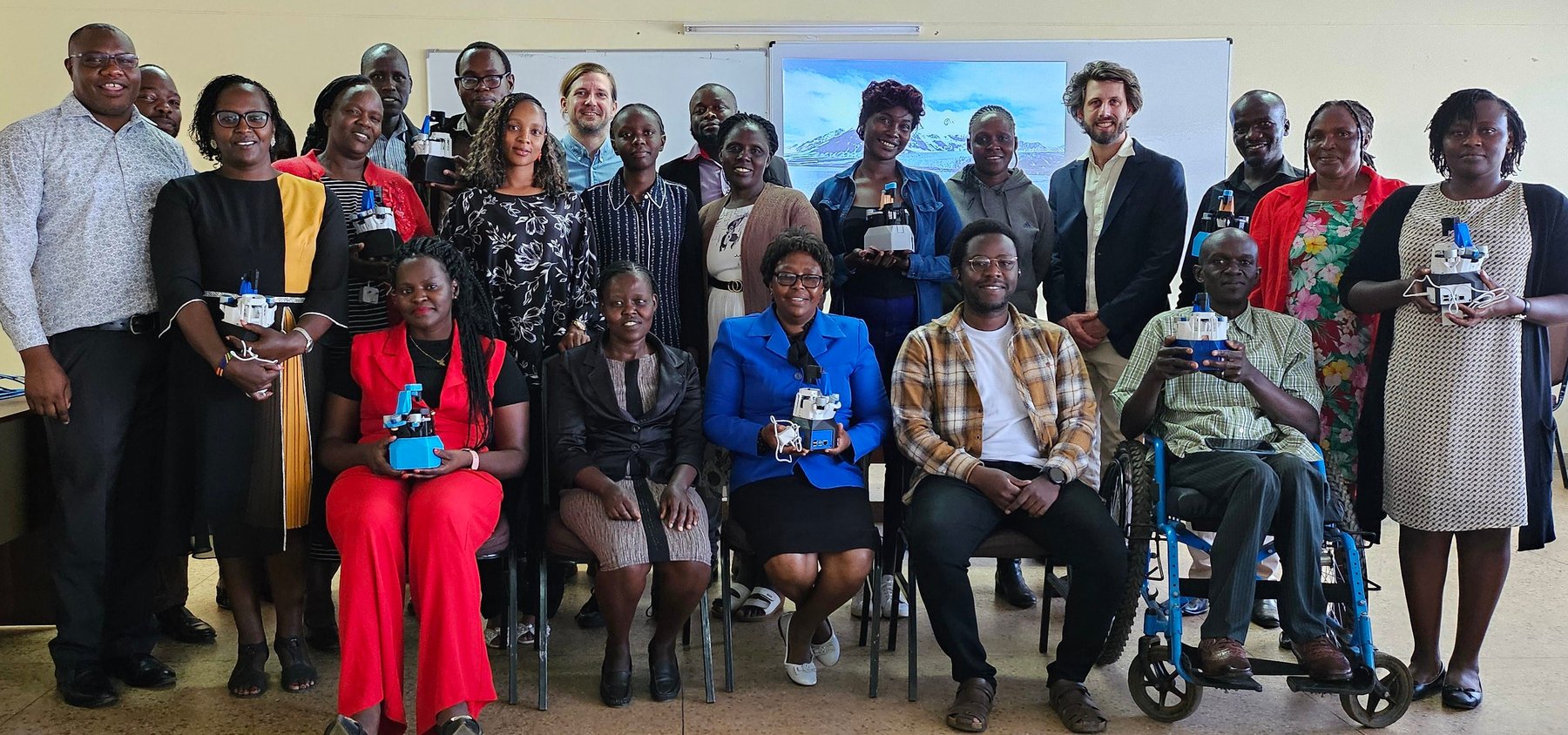 Participants show off their OpenFlexure Microscopes after a workshop at Eldoret University